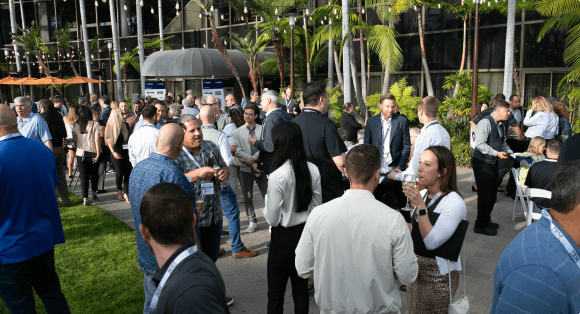 Senior Level Executives networking at dinner in San Diego for the Quartz Network Summit